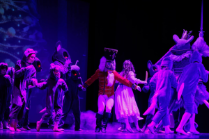 A children's cast of The Nutcracker perform on stage