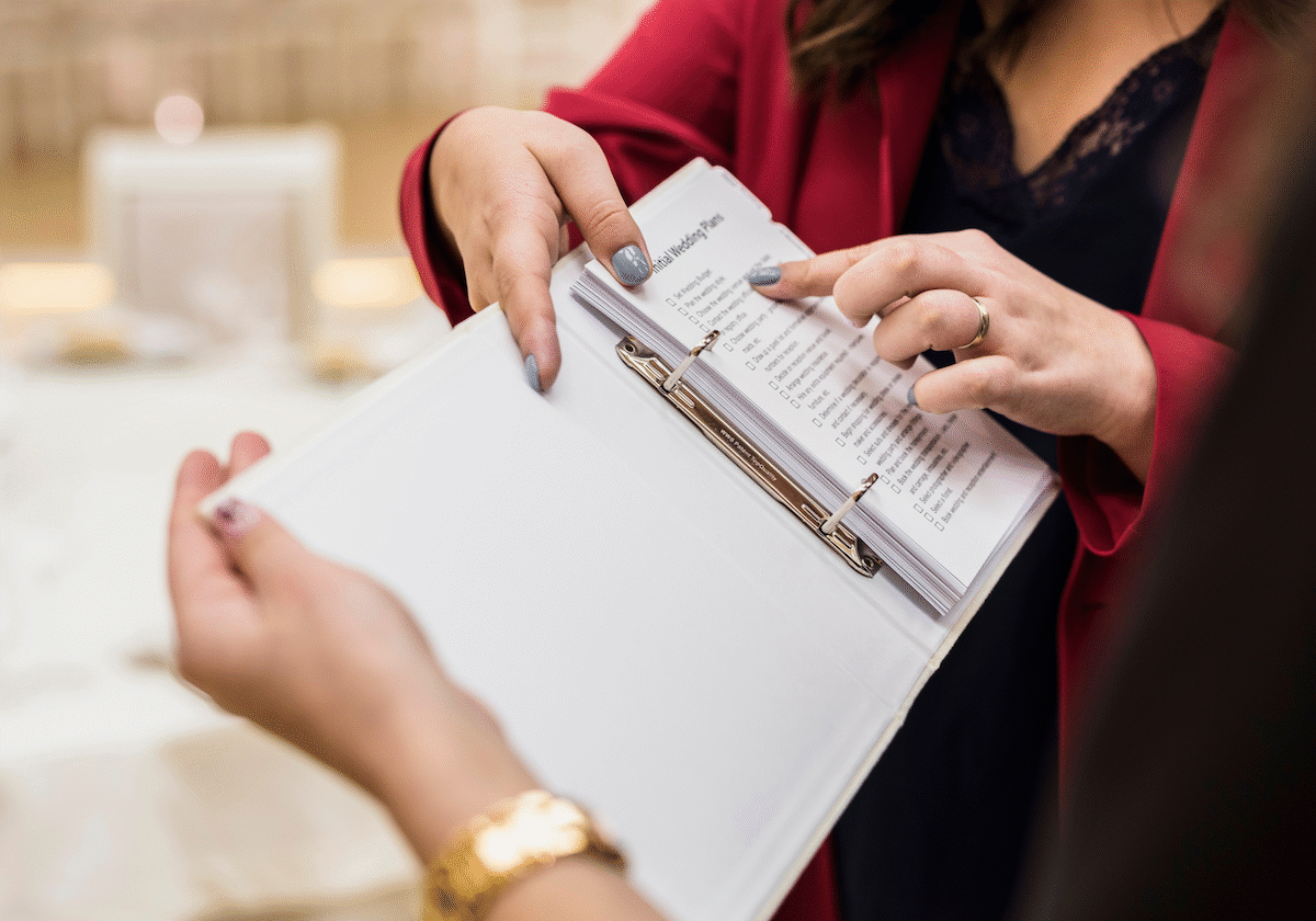 2025-09 AV Planner Checklist an event planner shows their av checklist to a colleague